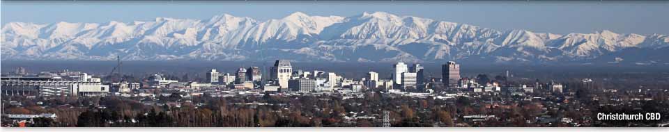 View of Christchurch CBD skyline with snow-covered mountains in the background